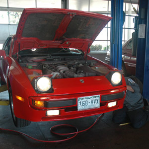 Car being serviced at an auto repair shop in Centennial