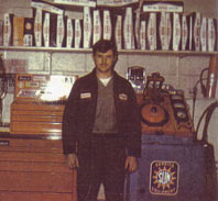 Terry as head auto mechanic and manager in 1972